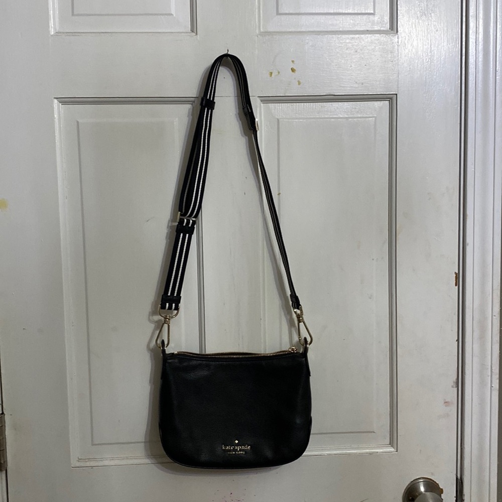 A Kate spade white and black striped purse cross body